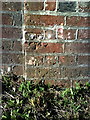 Benchmark on railway bridge at junction of Barnes Way and Monmouth Road