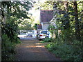 Gate lodge and gate at NW entrance to Buxted Park