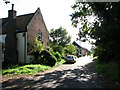 Farmhouse and barn conversion beside the B1140 road