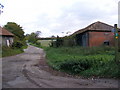 TM3670 : Footpath to Pam's Covert & Sibton Green & entrance to North Grange Farm by Geographer