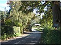 SJ5366 : Road passing Oak Tree Farm by David Smith