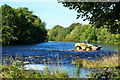 Farm vehicle crossing the Ford on the River Tees