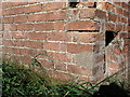 Haltham, Cowpasture Farm bench mark on outbuilding