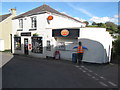 Stoke Gabriel Post Office with postman scarecrow