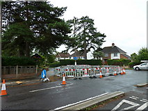 TQ1630 : Roadworks at the junction of Merryfield Drive and Guildford Road by Basher Eyre