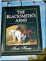 The sign for the Blacksmith