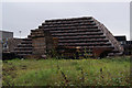 A stack of whisky barrels