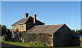 Farmhouse with wooden garage