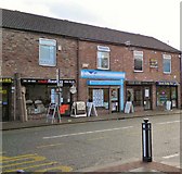 SJ9295 : Shops on Stockport Road by Gerald England