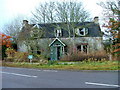 Dilapidated house at the crossroads