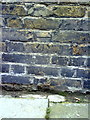 Benchmark on the wall of Wellington Gardens
