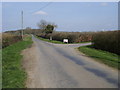 Road passing entrance to Pool Farm