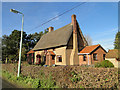 Thatched and pebble-dashed cottage in S. E. St James