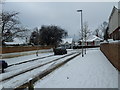 Approaching the junction of a snowy  Evelegh Road and Farlington Avenue