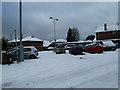 A snowy car park in Aldsworth Close