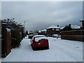 Approaching the junction of a snowy  Aldworth Close and Aldworth Gardens