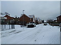 Junction of a snowy  Aldworth Close and Aldworth Gardens