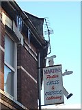 SX9393 : Icicles and shop sign in Pinhoe Road by David Smith