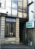 SE1021 : Part of an old shop sign, London House, Westgate, Elland by Humphrey Bolton