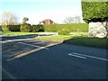 Neatly trimmed hedge around house at Adversane