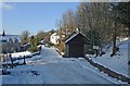 Snowy road at the edge of Wig Fach