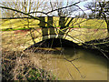 The River Yox flowing beneath the road bridge..