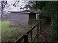 Shelter in paddock by footpath near Wonersh