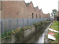 The River Ravensbourne at the rear of Catford bus garage, Bromley Road, SE6