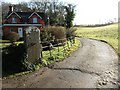 Drive and field next to Wood Lodge