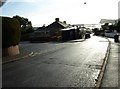 Junction of Mill Lane and Hutchings Way, with Teignmouth harbour in the distance