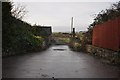 A bridge which carries a track to the sewage treatment works over Knowl Water