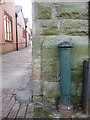 Bench mark by the town hall arch