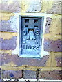 Flush bracket number 11028 on the side wall of the Post Office