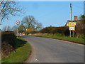 Sign for Ham village and speed limit at the road junction