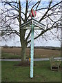 Village Sign And Pillory