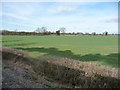 Smoke shadows over arable land