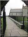 SH2482 : Path on the north and east side of St Cybi's church by John S Turner
