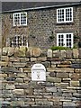 Postbox in the wall