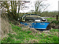 Derelict boat moored on the River Yare by Hall Farm, Postwick