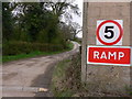 Farm track leaving the yard at Lowfold Farm