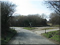 Road junction with a granite-based signpost