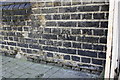 Benchmark on Stourcliffe Street wall of West London Synagogue