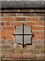 Perforation in a brick wall