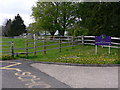 Footpath sign and stile by Duncton School