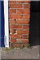 Benchmark on the garage of 16B Castle Crescent