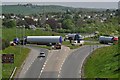 SS5531 : A wind turbine tower being transported around Lake roundabout on their way to Fullabrook Wind Farm by Roger A Smith