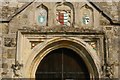TQ9017 : Winchelsea: St Thomas's church, coats of arms over west porch by Christopher Hilton