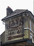 TQ3875 : Ghost sign on a building in Clarendon Road, SE13 by Mike Quinn