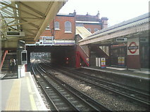 TQ2478 : Looking east from Barons Court Underground station by Marathon