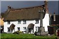 Memorial and Thatched Cottage in Lustleigh